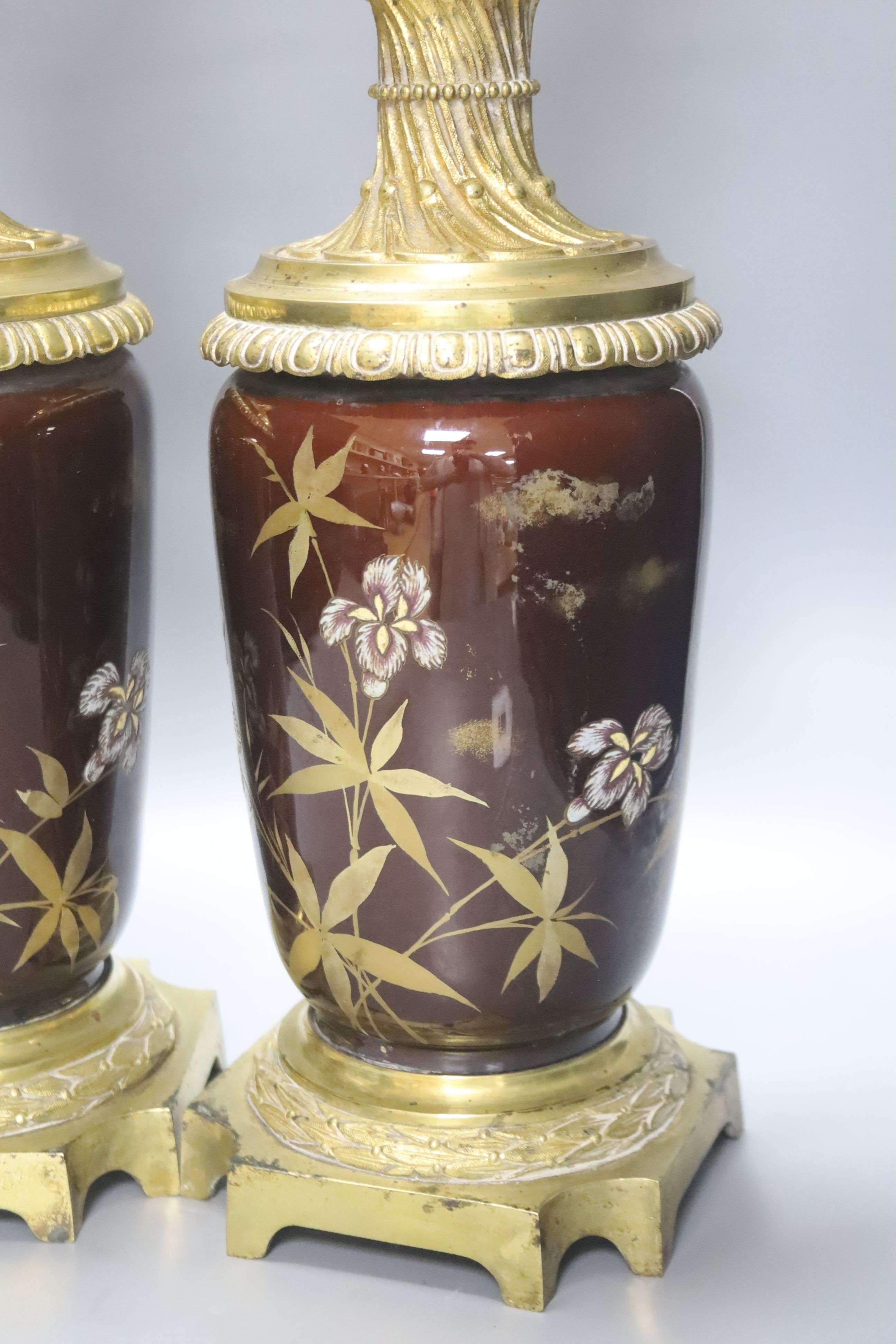 A pair of 19th century French ormolu and enamelled oil lamps, height 46cm